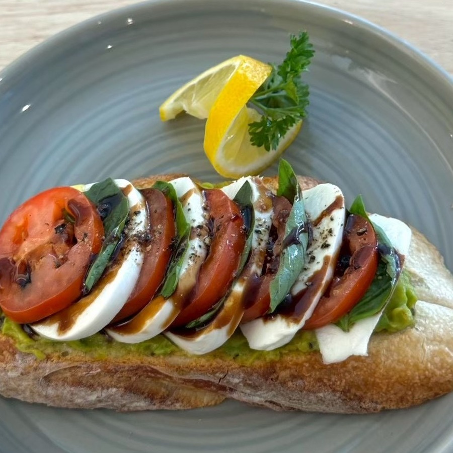 Real Caprese-Avo sourdough toast with mozzarella, tomato, and basil at Sunflower Smoothies & Coffee in Chiang Mai