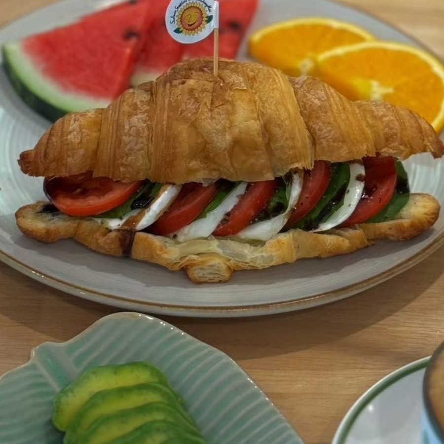 Real Caprese croissant with mozzarella, basil, and pesto at Sunflower Smoothies & Coffee in Chiang Mai